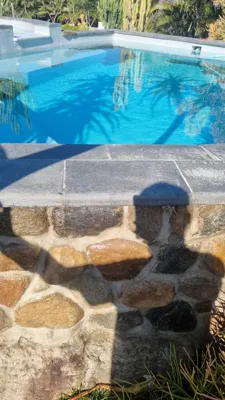 Custom Stone cladding and double bullnose coping around pool