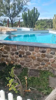 Custom natural stone work to finish off rock swimming pool