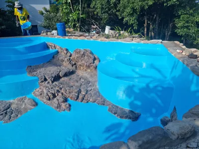 Pool designed and build using the natural stone structures already on site