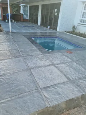 Tiny splash pool with large paving